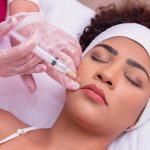 applying hyaluronic acid enzymes japanese mustache young woman s face aesthetic treatment.jpg