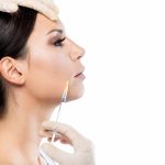 beautiful young woman getting botox cosmetic injection her face.jpg