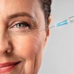 smiley elder woman using injection her eye wrinkles.jpg