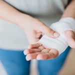 woman with gauze bandage wrapped around her hand.jpg